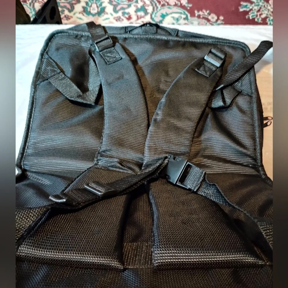 Auto drive backpack folds into a travel bag. Never used, black.